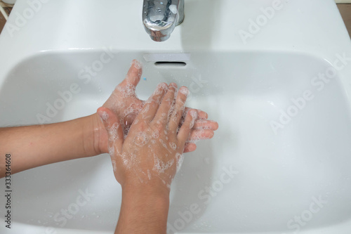 Little boy waiting for washing hand