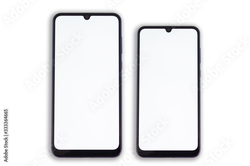 Two oval smartphones of different sizes lie symmetrically to each other with clean screens.