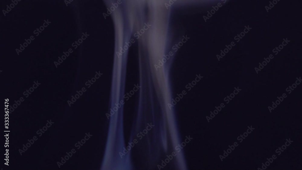 Smoke motion graphic. Smoke or steam effect on dark screen. Smoke motion graphic. Smoke or steam effect on dark screen.