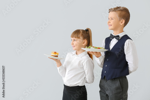 Cute little waiters on ligh...