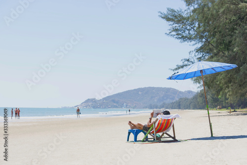 Tourism on canvas bed and umbrellas on the beach Background Blurry Tourism and sea at Suan Son  Pradipat Beach   Prachuap Khiri Khan in Thailand.February 16  2020