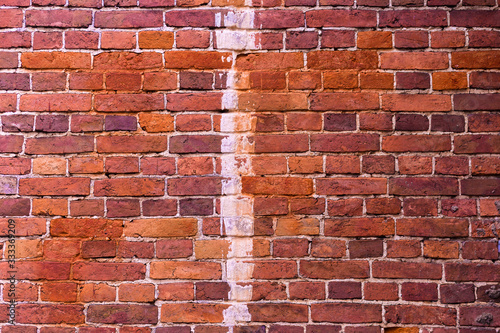 Old grunge brick wall background. Close up modern red brick tiles wall texture background. Close up