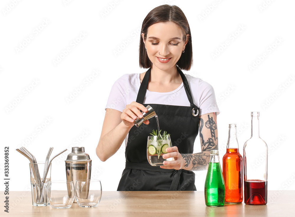 Beautiful female bartender at table against white background Beautiful female bartender at table against white background