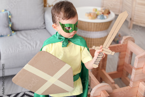 Little boy dressed as knigh...