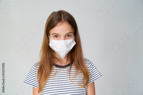 girl in medical mask on white background