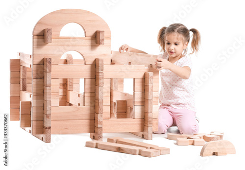 Little girl playing with ta...