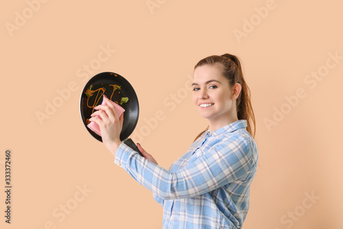 Woman with dirty frying pan...