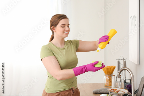 Woman washing dirty dishes ...
