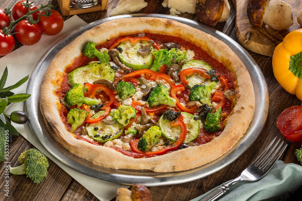 Vegetarian pizza with broccoli, pepper, mushrooms Vegetarian pizza with broccoli, pepper, mushrooms