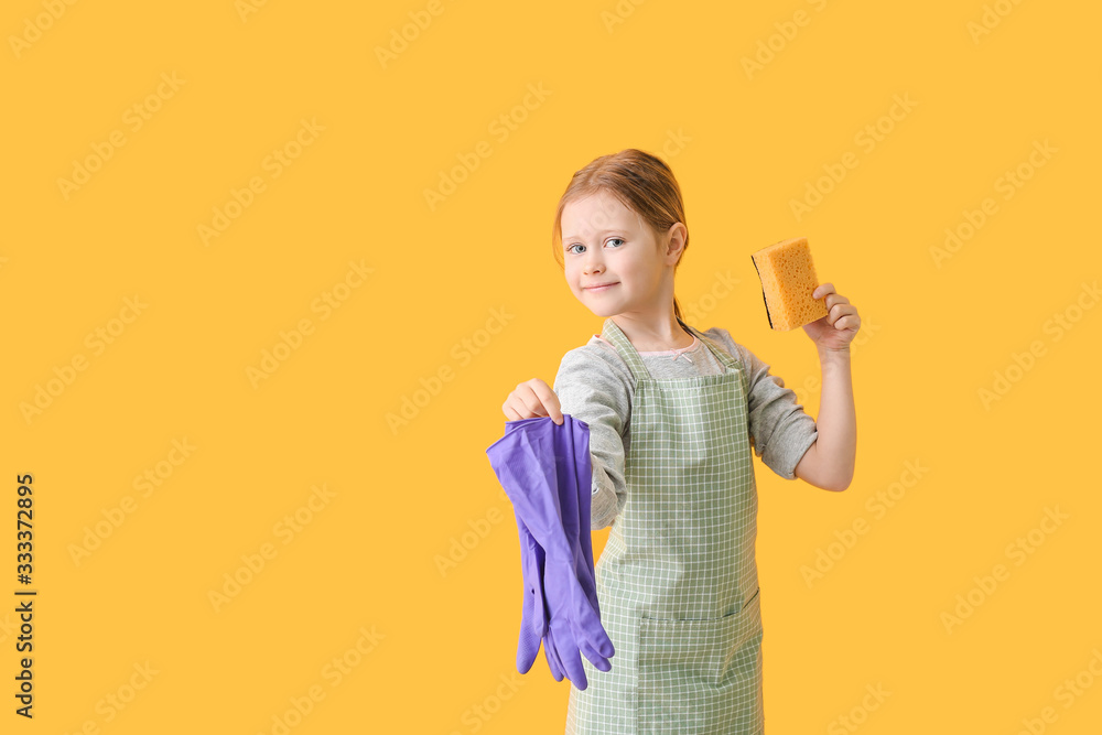 Little girl with sponge and rubber gloves on color background Little girl with sponge and rubber gloves on color background