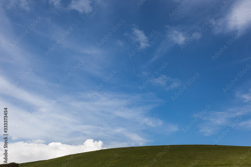 Mountains view in spring beneath a big, deep sky Mountains view in spring beneath a big, deep sky