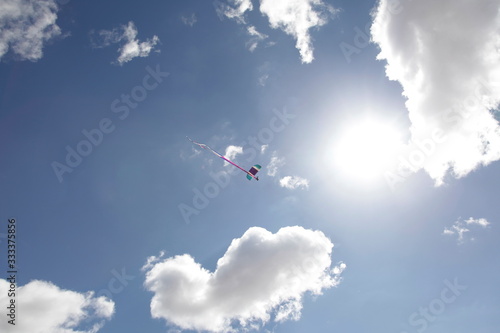 Skydiver in a bright blue sky