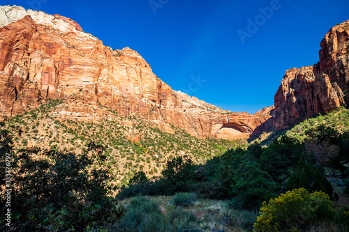 Southwest usa Zion National Park The main part of the park is Zion Canyon surrounded by the walls of the Deertrap, Cathedral and Majestic Mountain mountains. The Virgin River flows through the canyon.