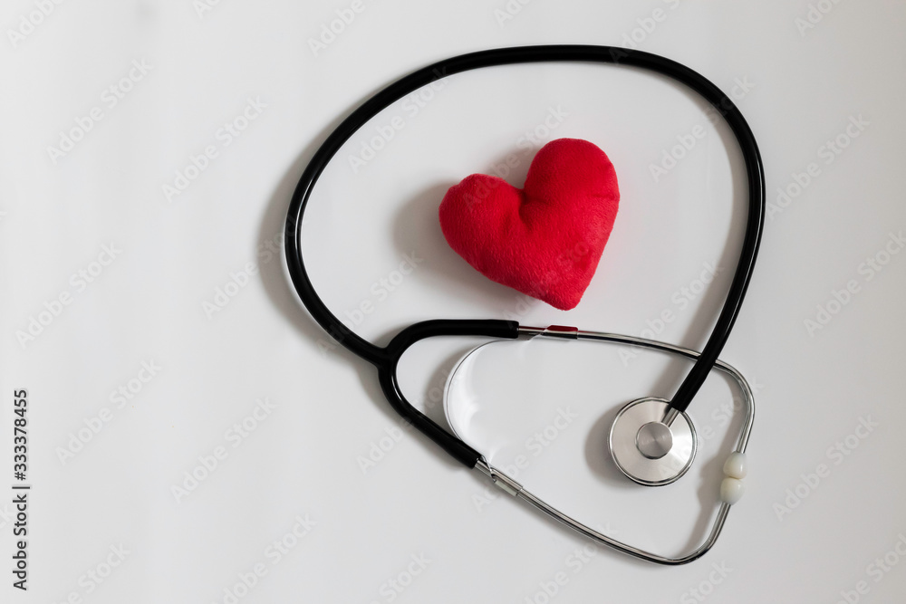 heart with stethoscope on pink background heart with stethoscope on pink background