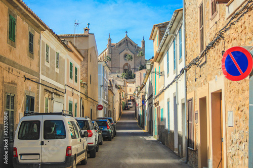Empty street in Arta with Transfiguracio del Senyor church in the background - Mallorca, Spain photo