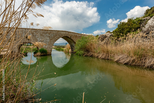 Seki, Elmalı - Antalya / Turkey. April 30, 2018. Xanthos river and historic Ottoman bridge at Urluca village near Fethiye town in Turkey. photo