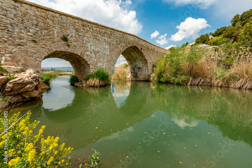 Seki, Elmalı - Antalya / Turkey. April 30, 2018. Xanthos river and historic Ottoman bridge at Urluca village near Fethiye town in Turkey. photo