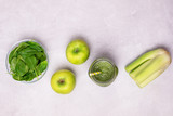 Glass Jar of Healthy Green Smoothie Detox Drink wirh Green Apple Celery and Raw Spinach Diet Beverage Flat lay