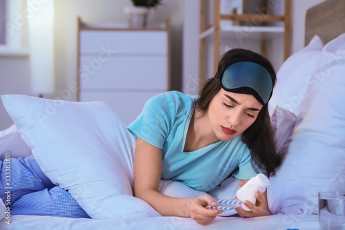 Young woman with pills for ...