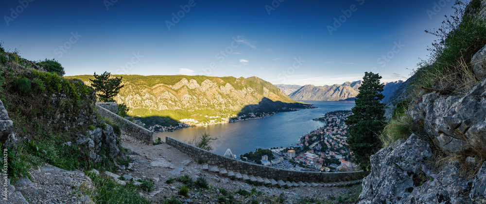 Sunny morning panoramic view of Kotor bay from ruins of Kotor's castle of San Giovanni, Montenegro.