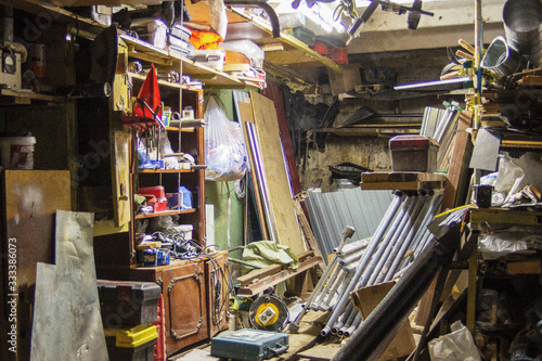 Big mess in an over stuffed suburban garage. photo