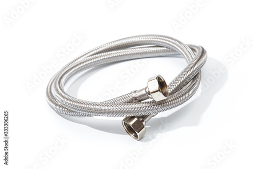 Chrome-plated corrugated hose for water isolated on white - Image