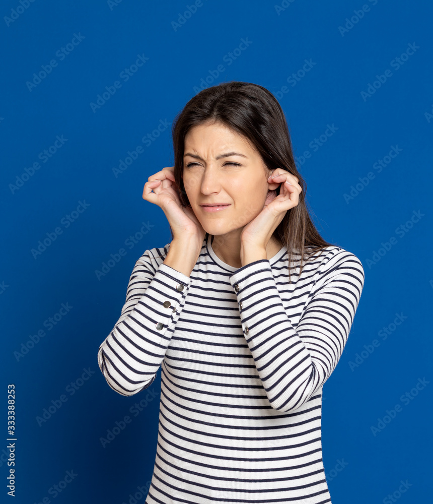 Brunette young woman wearing a striped T-shirt Brunette young woman wearing a striped T-shirt