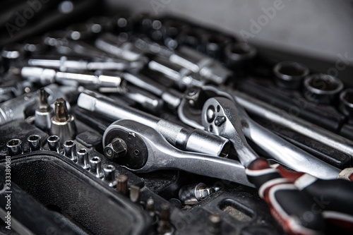 Obraz na płótnie Dirty used wrench and tools in mechanic tool box w salonie