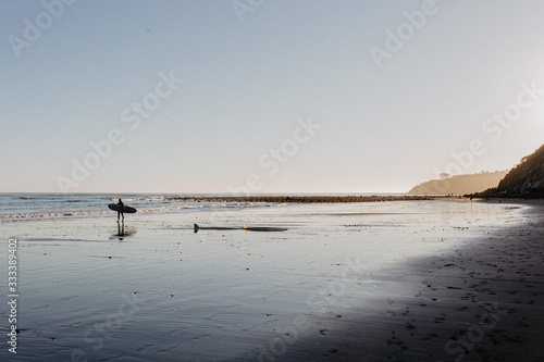 Surfer at the beach in winter