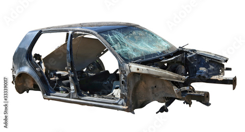 Broken wrecked disassembled passenger car of an unknown mass manufacturer isolated