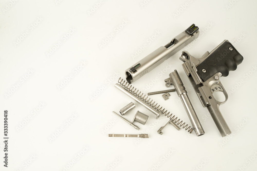 Parts of a .45 ACP hand gun, Model 1911. 11 mm gun. Parts of a .45 ACP hand gun, Model 1911. 11 mm gun.