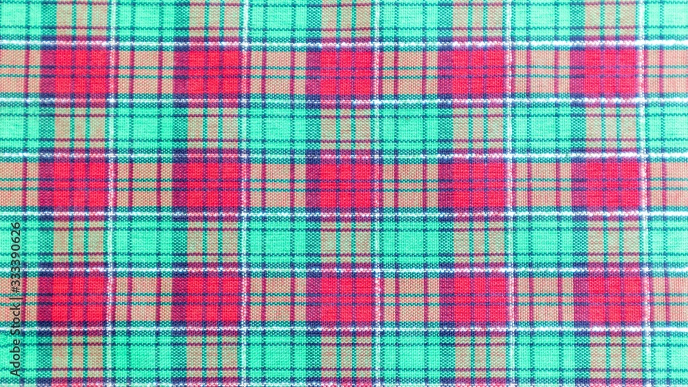 Fototapeta premium Green and red tartan or plaid background for fashion design. Tartan or plaid pattern. Tartan or plaid background, Tartan or plaid fabric texture.