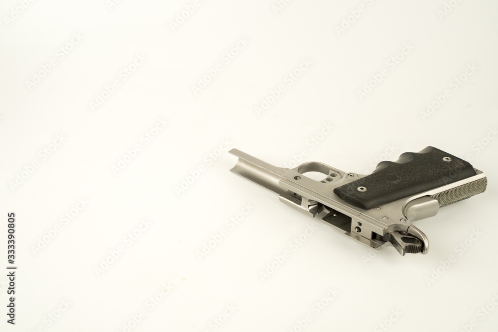 Parts of a .45 ACP hand gun, Model 1911. 11 mm gun.