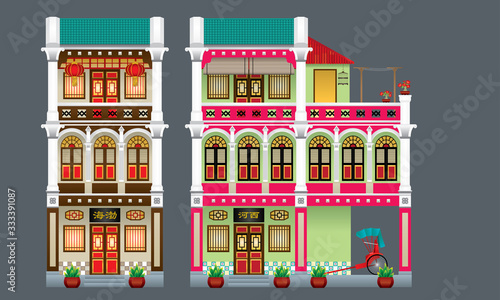 Three storey colorful and historical colonial style shop house. Isolated. Signboard's caption: the places where the owner's origin.