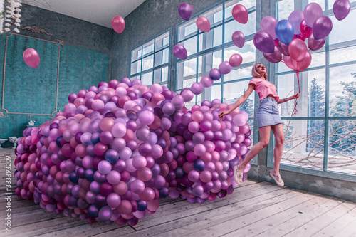 Woman with tank of balloons