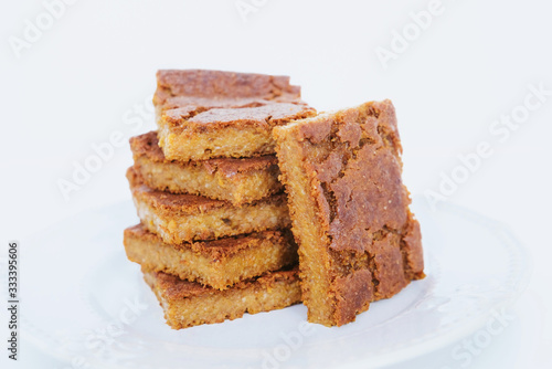 Freshly baked blondie brownie dessert slices, close up.