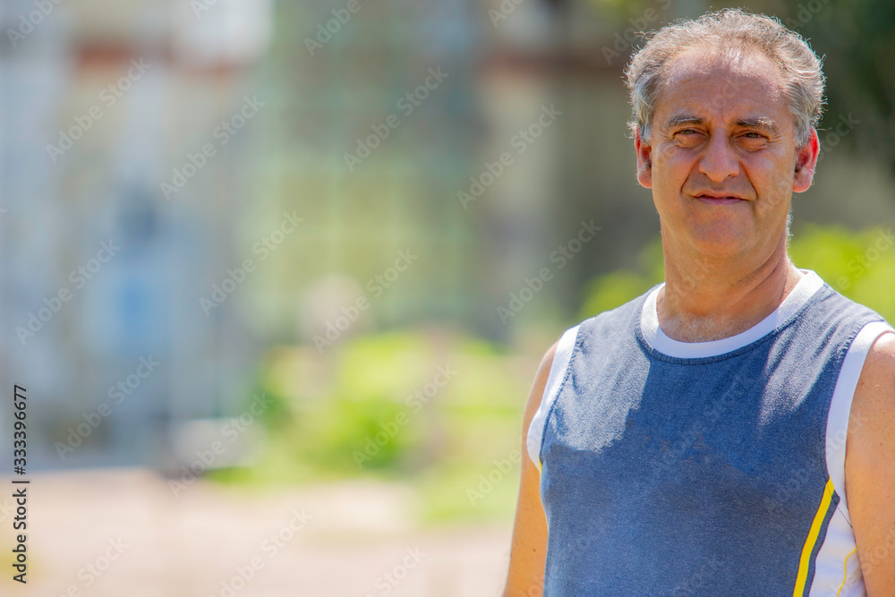 A man on a break during the walk on a sunny day A man on a break during the walk on a sunny day