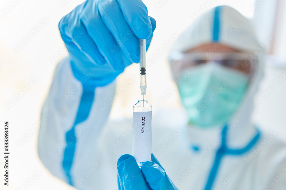Medic with syringe with Covid-19 vaccination Medic with syringe with Covid-19 vaccination