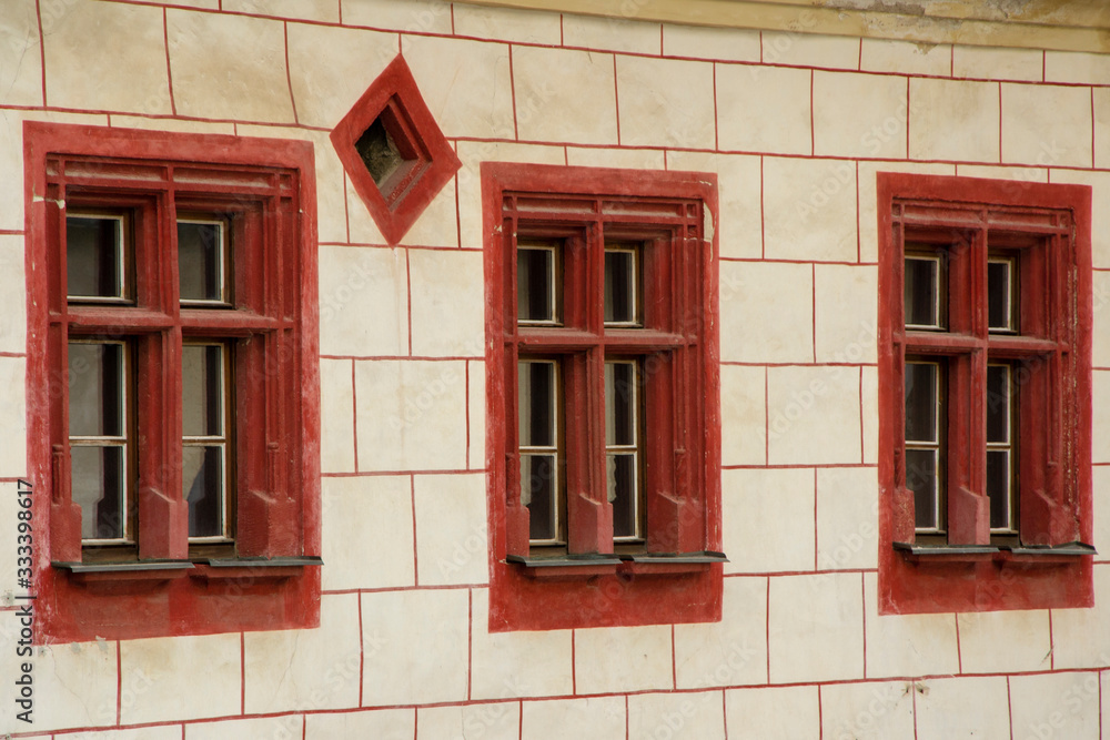 Obraz premium Three old red vintage windows