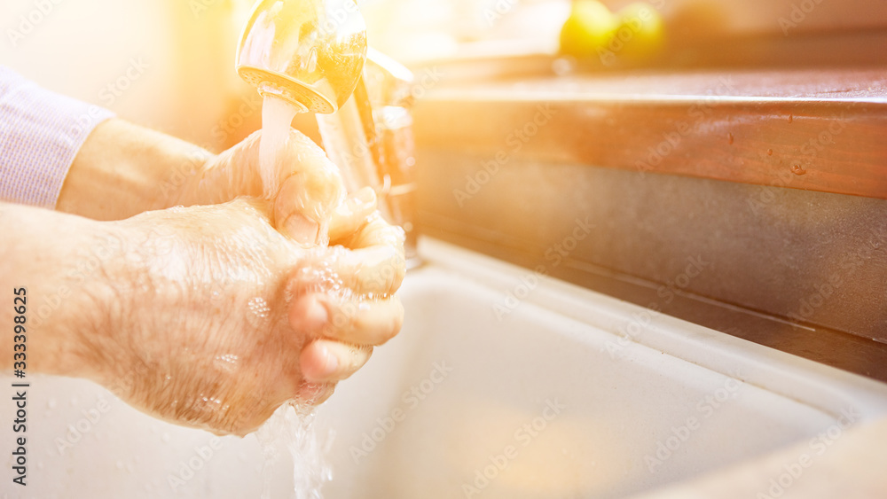 Elderly woman washing hands with soap for coronavirus Elderly woman washing hands with soap for coronavirus