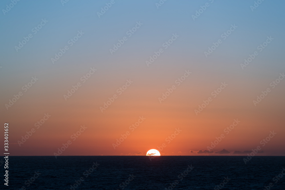 Sun going down in the ocean in the North Sea.