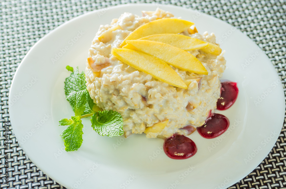Healthy eating Oatmeal porridge with mango and mint Healthy eating Oatmeal porridge with mango and mint