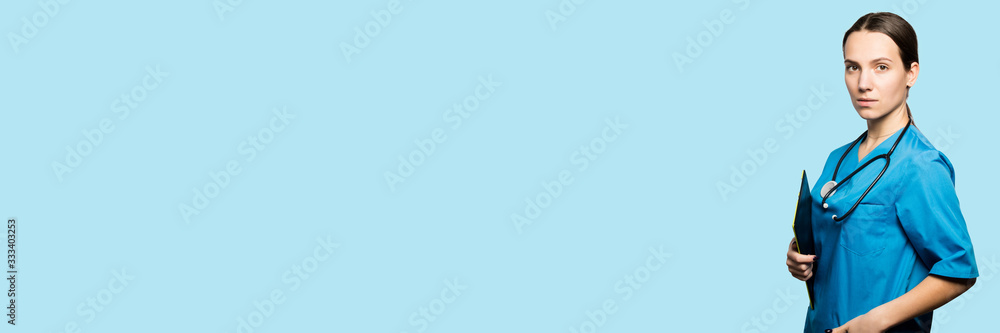 Doctor Surgeon woman with stethoscope. Copyspace backdrop. Doctor Surgeon woman with stethoscope. Copyspace backdrop.