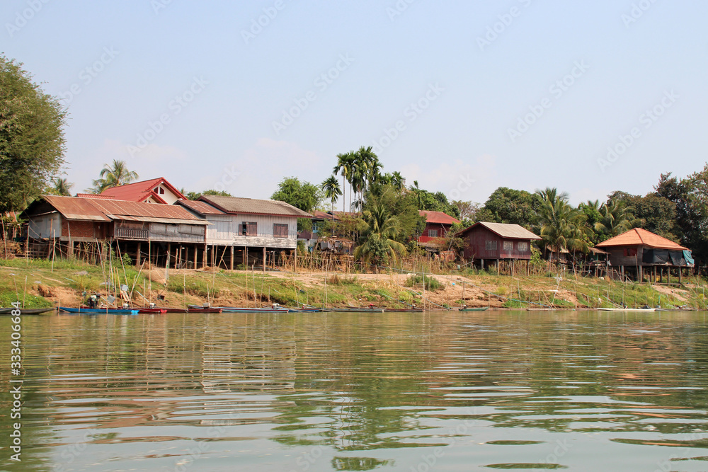 village along the river mekong (laos) village along the river mekong (laos)