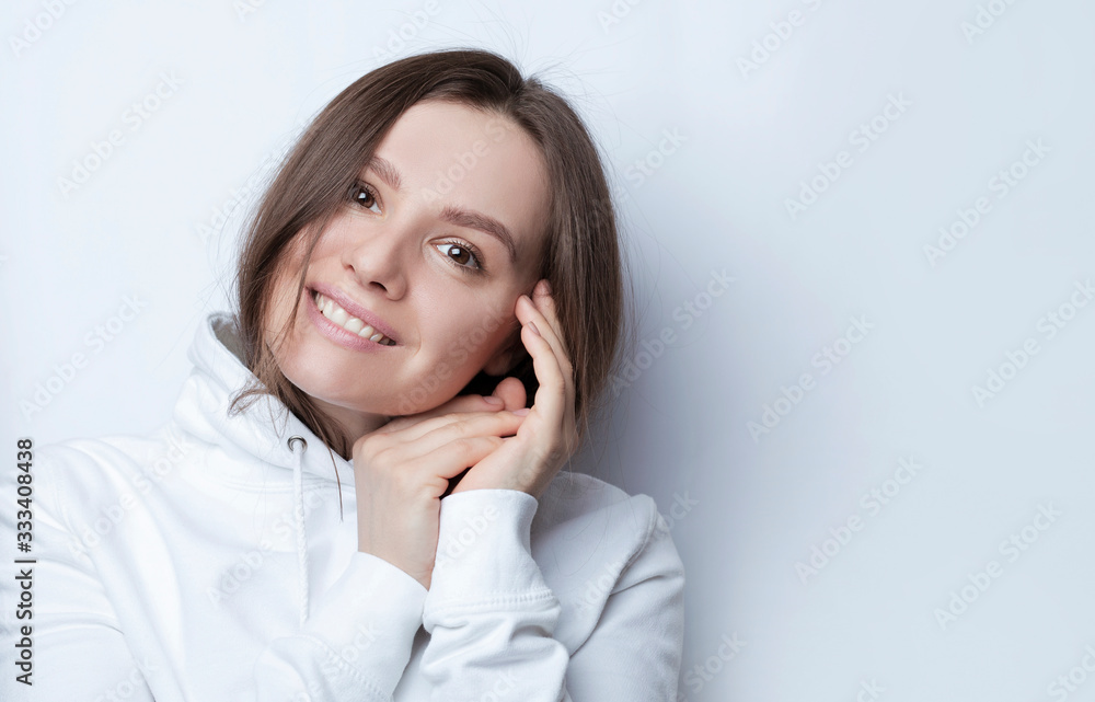 Portrait of cheerful woman has shy satisfied expression, smiles broadly, shows white teeth Portrait of cheerful woman has shy satisfied expression, smiles broadly, shows white teeth