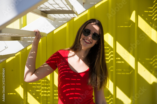 Trendy young woman standing...