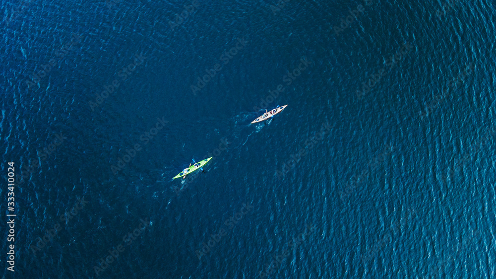 athlete kayaks on the river . Travel or kayaking concept. Drone shot, aerial view, picture with place for your text athlete kayaks on the river . Travel or kayaking concept. Drone shot, aerial view, picture with place for your text