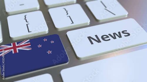 News text and flag of New Zealand on the keys of a computer keyboard. National online media related conceptual 3D animation photo