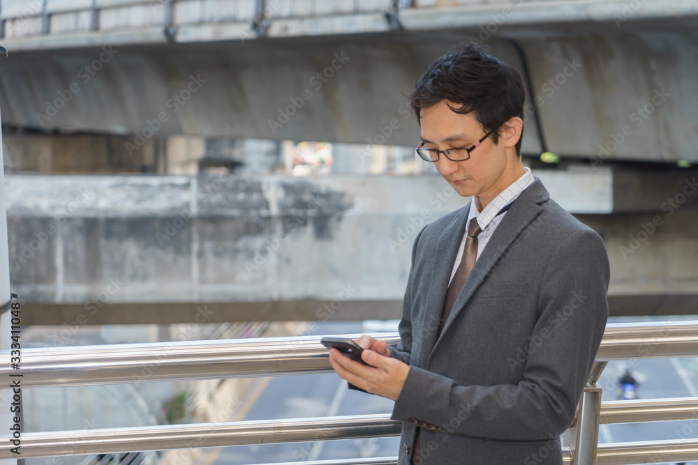 Middle aged businessman is using smartphone. Middle aged businessman is using smartphone.