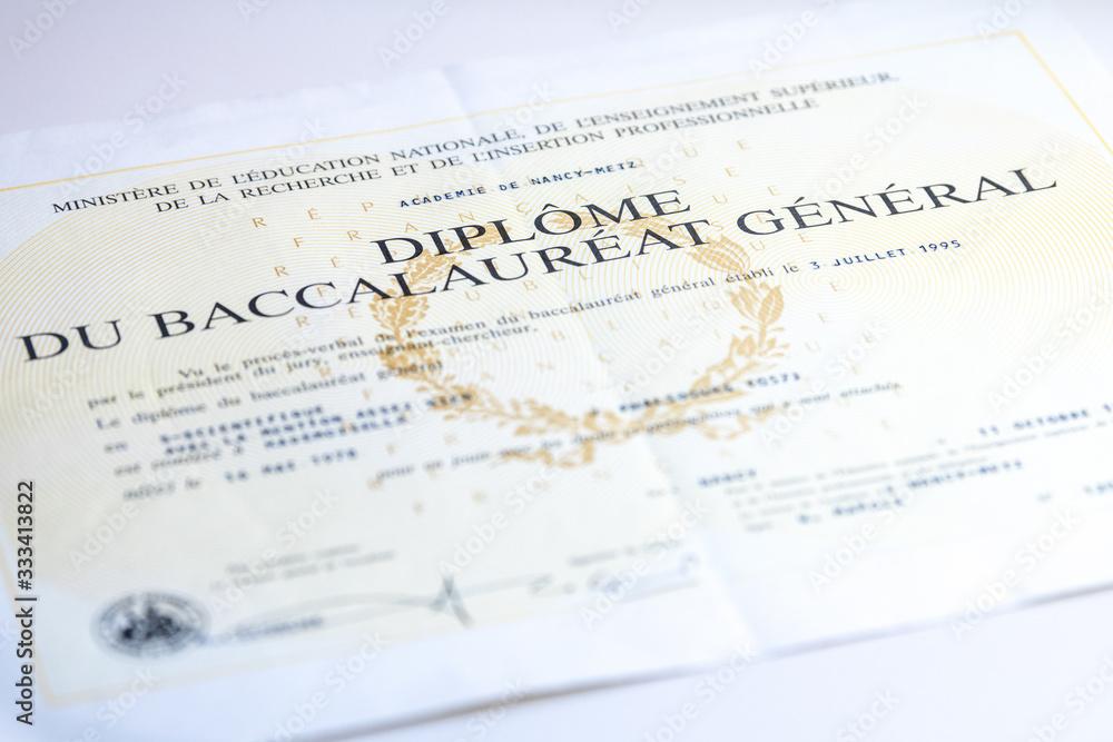Obraz premium Baccalaureate certificate on a wooden table in France
